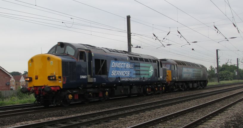 DIRECT RAIL SERVICES DRS locomotives Class 37 37607 heading south from York passing Copmanthorpe Crossing entered service in 1963 as D6803, also carried number 37511  37103