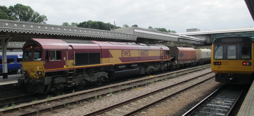 Trainspotting at Sheffield station Sheffield Station: Ex EWS Class 66 diesel-electric locomotive hauled freight train of gravel aggregates passing through Sheffield station. A Class 142 DMU train on the right with a train from Sheffield to Huddersfield via Penistone.