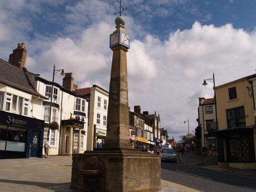 Looking up the main street east from the 'market cross' towards St Nicholas Church, Guisborough, North East England