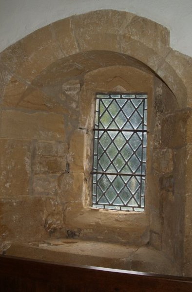 A little early Norman one light window St Oswald's Church, Thornton Steward Circular walk from Jervaulx Abbey