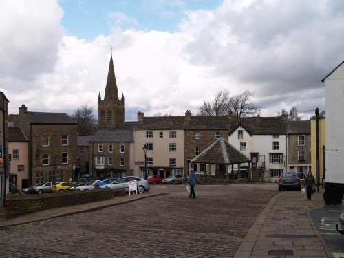 It has many 17th century stone built buildings. The Market Square and Market Cross are centre stage and the spire of St Augustine's Church towering over the houses around the town centre. Alston Town, Cumbria, North Pennines, Northern England