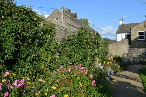 Community Orchard Garden attached to Hudson House Centre in Reeth village, Swaledale, Yorkshire Dales National Park, North Yorkshire, England