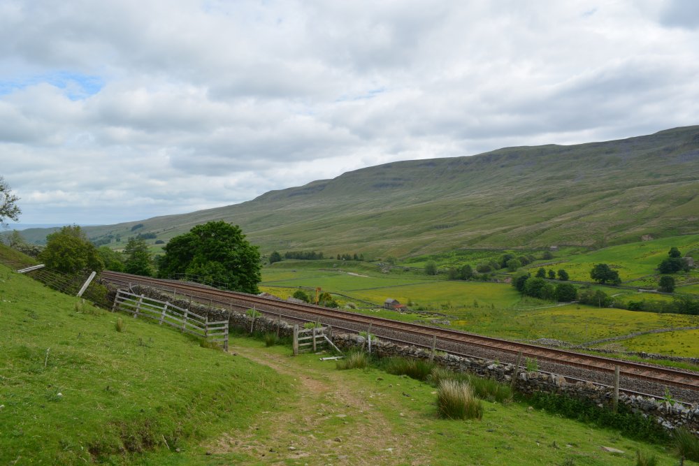 Winding the way up Turner Hay Hill. Climbing up Wild Boar Fell, walk from Mallerstang Dale, Cumbria, England
