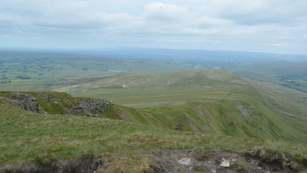 Looking back down from the Nab along White Walls to High Dolphinsty Climbing up Wild Boar Fell, walk from Mallerstang Dale, Cumbria, England