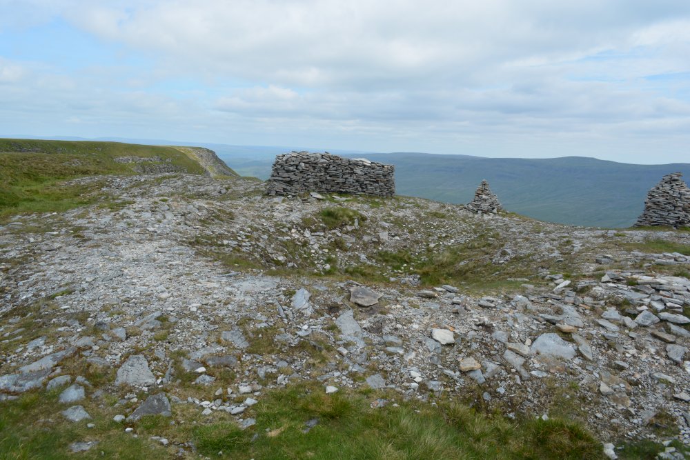 triangular stone shelter on top of High White Scar Climbing up Wild Boar Fell, walk from Mallerstang Dale, Cumbria, England