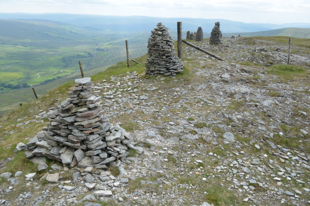 views of the cairns on the edge of High White Scar Climbing up Wild Boar Fell, walk from Mallerstang Dale, Cumbria, England