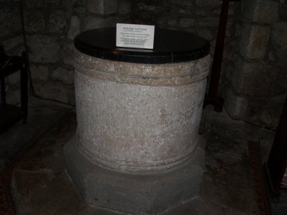 Norman tub font in the Church of St Michael and All Angels, Linton walk from Grassington, Wharfedale, North Yorkshire Dales National Park, England