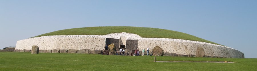 39. The full frontal facade and standing stones (megaliths) of the entrance to Newgrange prehistoric monument in the River Boyne Valley, Co. Meath, Ireland