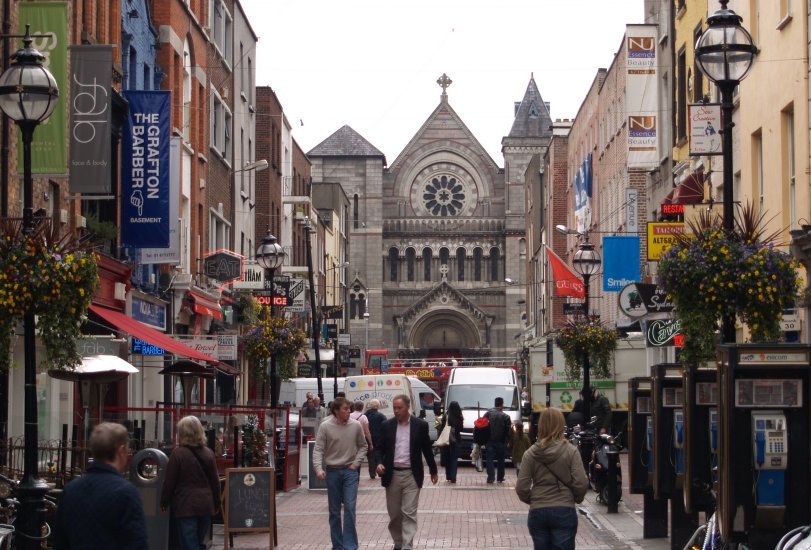 54. Looking down Ann Street off Grafton Street, to St Ann's Church in Dawson Street (originally built ~1721, Romanesque facade was built in 1868), Dublin City centre.