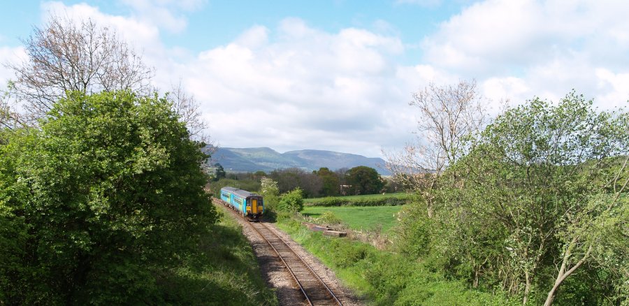 Location 06c: The train climbs out of Battersby Junction and heads for Kildale with the Cleveland Hills in the back ground.