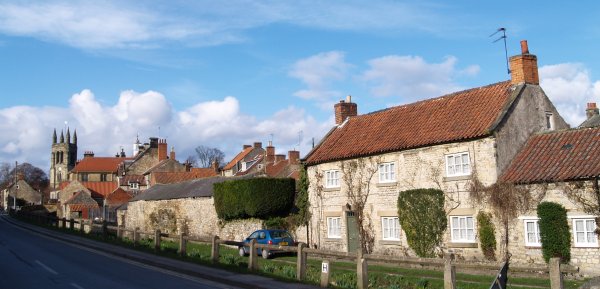 some of fine limestone buildings in the 'back street' of Helmsley, with the Parish Church tower on the left.