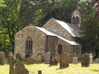 The quiet, almost hidden setting, of All Saints Church, Hawnby on the banks of the River Rye.