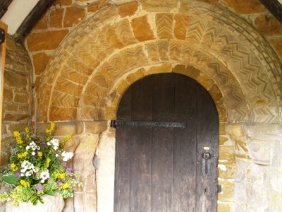 The porch of 1878 now protects the superbly carved Norman archway of about 1140 with multiple zig-zag and other ornamentation. The ancient oak door (date ?) still works fine!