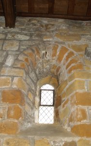 An original Norman windows in the north wall of the nave.