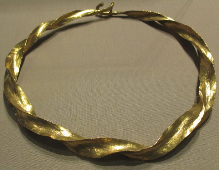 A Bronze Age gold torc, carefully twisted from a thin gold bar (1200 - 1000 BCE) National Museum of Ireland, Archiology section