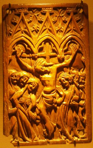 A plaque image of crucified Christ flanked by the Virgin and St John made of ivory from the workshops of Paris in the 14th century in the National Museum of Ireland, Dublin, Ireland