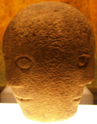 The three faces of the carved stone head (1st - 2nd century CE AD) Archaeology of the National Museum of Ireland, Dublin, Ireland
