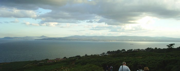 The 'jolly band' looking across Dublin Bay to the sunset over the Wicklow Mountains on the beautiful Howth Cliff walk north of Dublin City.