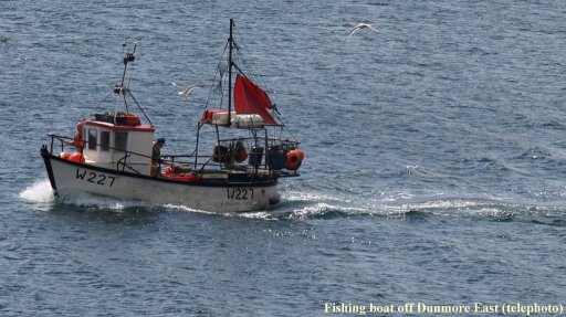 Fishing boat W227 returning to Dunmore East Harbour. Co. Waterford, Ireland.