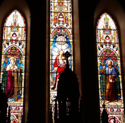 The magnificant stained glass window above the alter of the Church of the Assumption, Mooncoin, Ireland The magnificant stained glass window above the alter of the Church of the Assumption, Mooncoin, Ireland