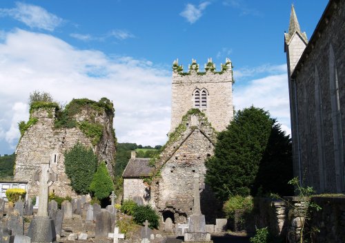 On the left, St Mary's and the Catholic Church of St. Columcille on the right. - Inistioge, County Kilkenny, Ireland
