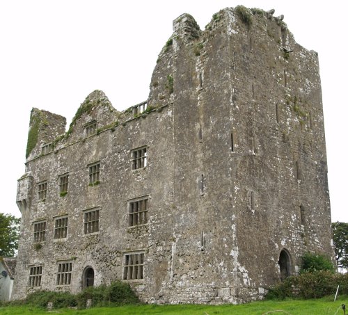On the right hand-side of Lemeneagh Castle is the part of an older tower - Car drive from Kilfenora to Ballyvaughan, The Burren, County Clare, West of Ireland