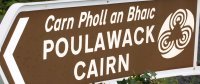 Carrying on up the R480 road you will see the sign for Poulawack Cairn. - Car drive from Kilfenora to Ballyvaughan, The Burren, County Clare, West of Ireland