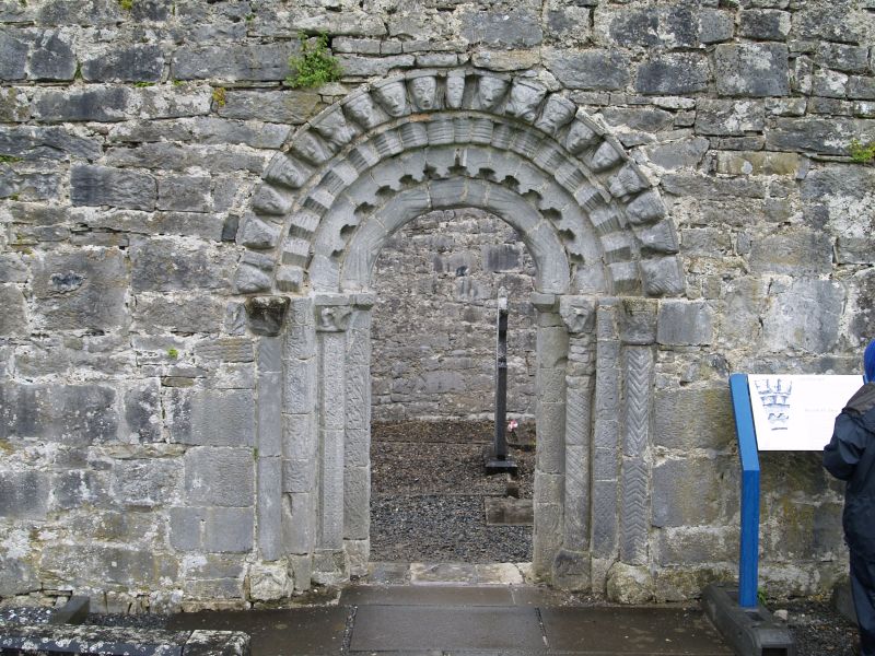 The fine Romanesque doorway of four orders surrounded by a row of animal and human heads - Dysert O'Dea Abbey near Corofin, County Clare, West of Ireland