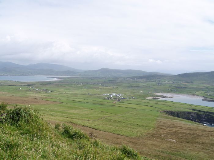 Looking south to the beach and the few houses at Ferriters Cove and the bay of Smerwick Harbour The Three Sisters Walk near Ballyferriter, Dingle Peninsular, Co. Kerry, West of Ireland