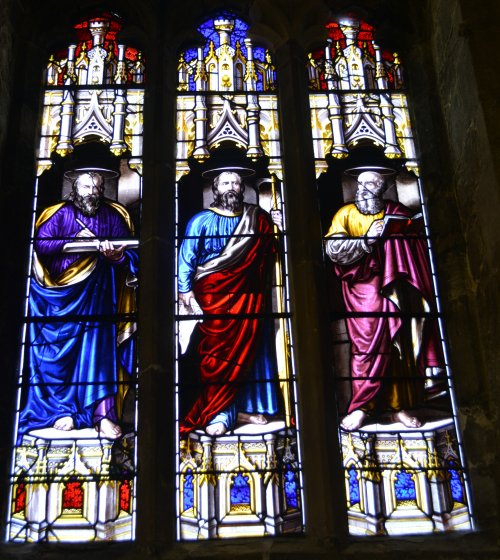 Some of the many fine stained glass window panels in Saint Deiniol's Cathedral, Bangor, North Wales