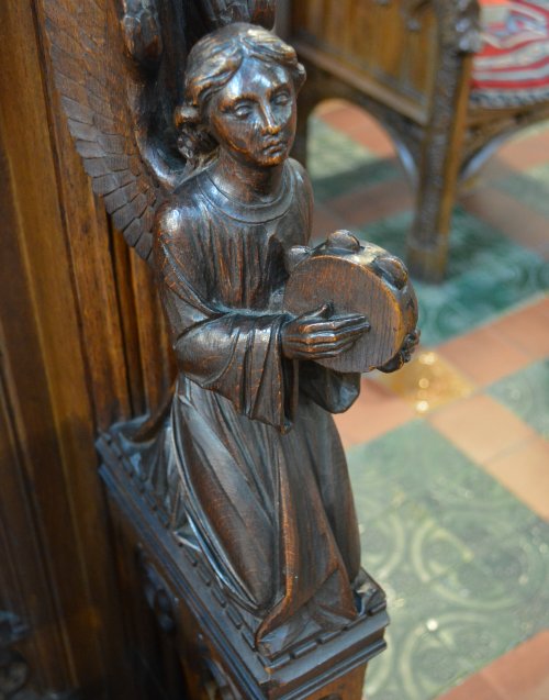 There are some great carvings on the choir chapter stalls including musicians and grotesque heads of animals in Saint Deiniol's Cathedral, Bangor, North Wales