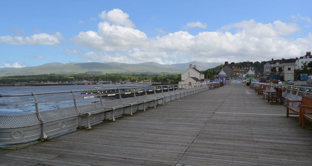 Looking landwards south down the Bangor Garth Pier with the Welsh Hills in the distance