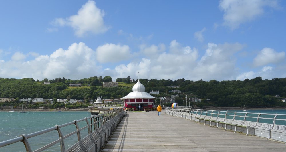 Looking beyond the pier cafe of the Bangor Garth Pier across the Menai Straits to the island of Anglesey North Wales, UK, Great Britain