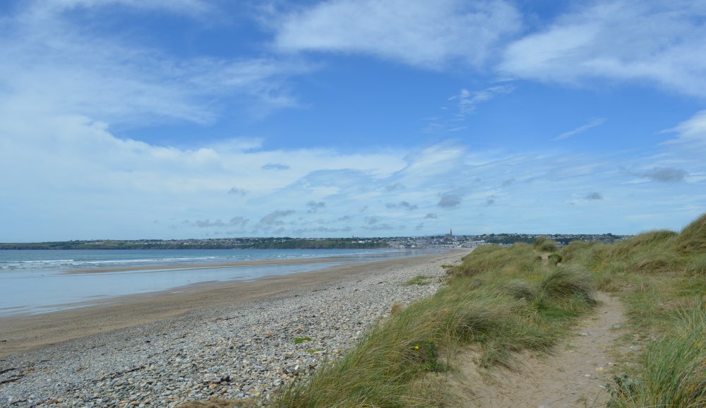 The fine sand and pebble blue flag beach of Tramore Strand and a nice walk along the dunes Co. Waterford Ireland