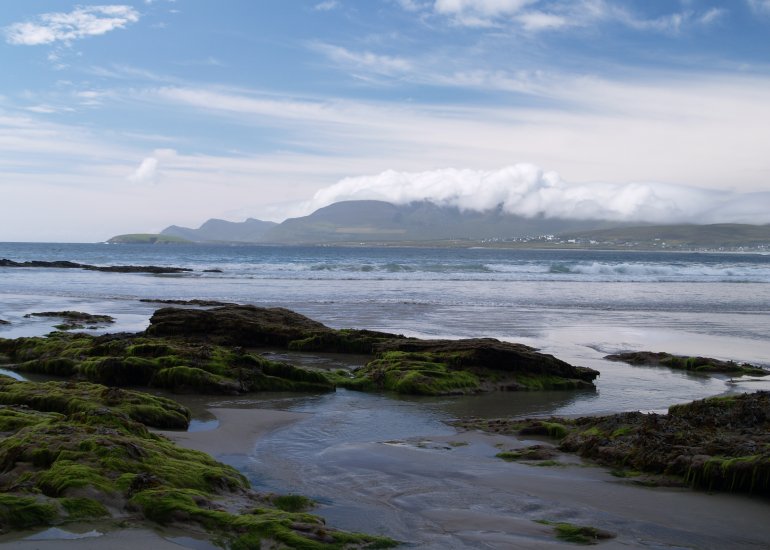 104.  Beach, waves, rocks, seaweed, hills and cloud cover over Croaghaun Mountain, Keel Strand, Achill Island, Co. Mayo, Ireland.