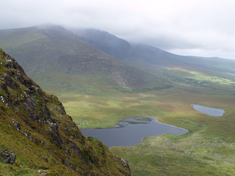 57. The broody cloud covered Brandon Mountain range viewed from the top of the Connor Pass, The Dingle Peninsular, County Kerry, West of Ireland, Selected scenic views from holidays in Ireland