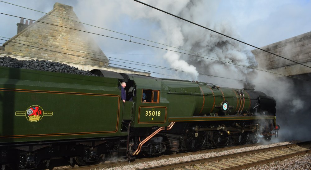 steam locomotive 35018 British India Line Merchant Navy Class Bullied 4-6-2 Pacific, leaving Carnforth with the Winter Cumbrian Mountain Express