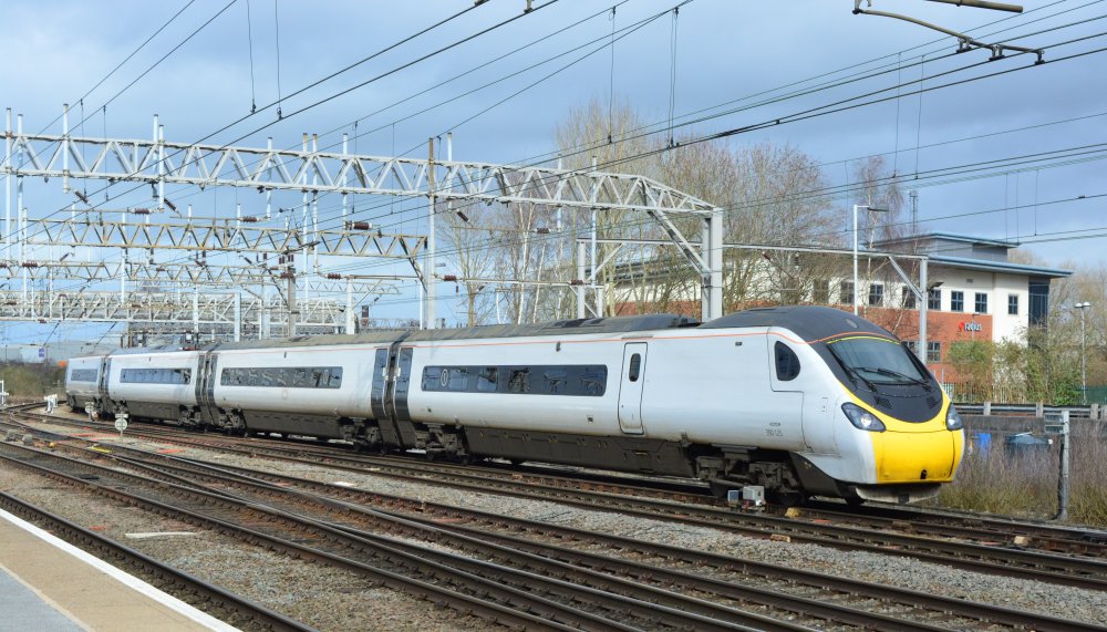 Trainspotting at Crewe station: Silver grey liveried Class 390 EMU 390125 entering Crewe station with an Avanti West Coast service from Manchester Piccadilly to London Euston (March 2020)