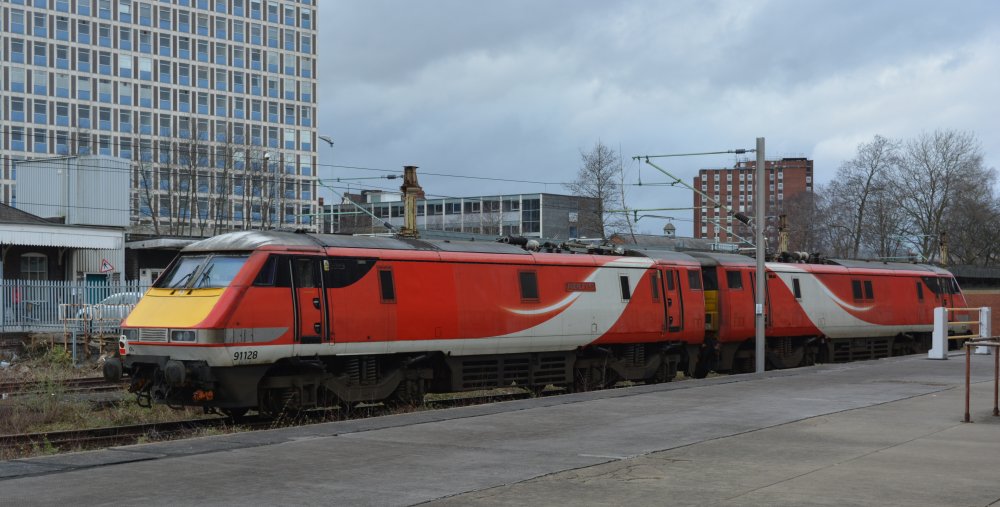 Trainspotting at Crewe station: An uncertain future?: Class 91 electric locomotives 91128 and 91122 parked in the yard along side Crewe station (March 2020)