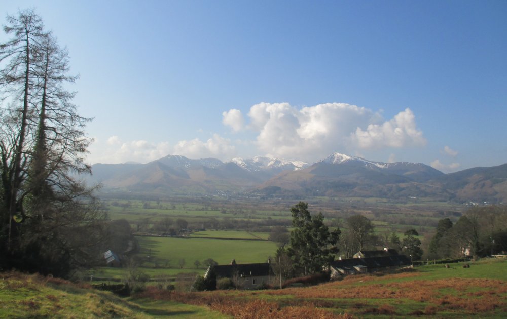 Looking back south to all the Lakeland Fells Climbing Skiddaw from Millbeck, Cumbria, Lake District National Park, England