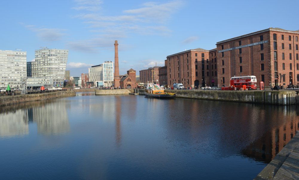 A broad view of Canning Half Tide Dock with modern residential and office developments in the distance Liverpool's historic docks England