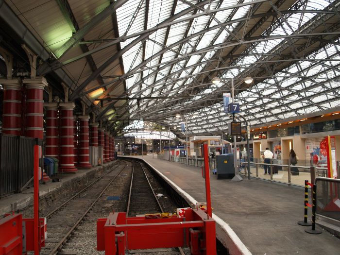 Liverpool Lime Street Station: The iron girders of the roof arches and the pillars supporting the roof arches.
