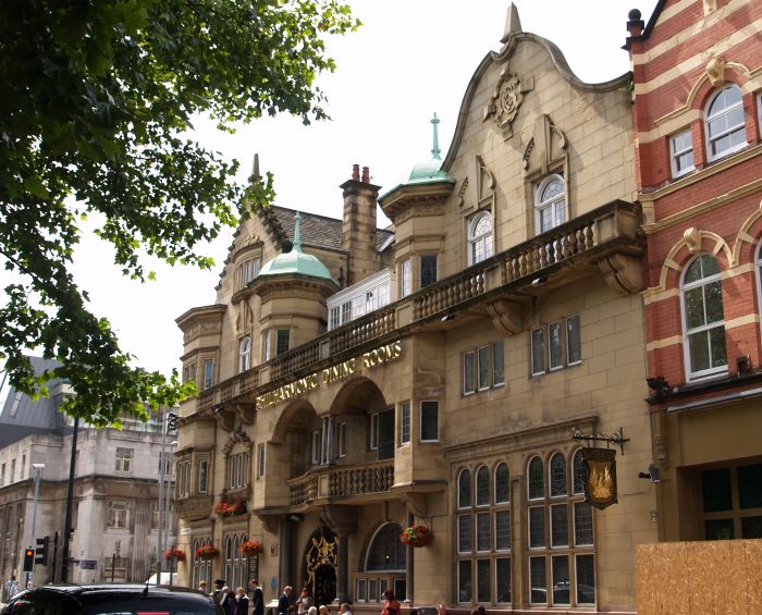 Liverpool The Philharmonic Hotel pub (also marked as the Philharmonic Dining Rooms) was built in 1898-1900 by Walter Thomas with steep gables and a double-curved balcony and iron gates by H. Blomfield Bare.