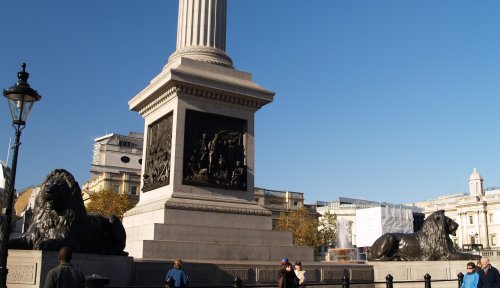 The 'guardian' lions at the base of Nelson's Column - Scenes of London Town and City, England