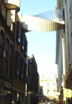 Near Covent Garden, (left) and interesting design of a connecting bridge between two blocks - Scenes of London Town and City, England