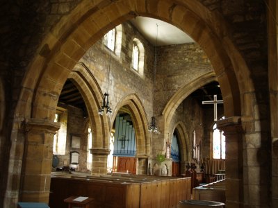 The nave with the arches of the north aisle in the centre of the picture.