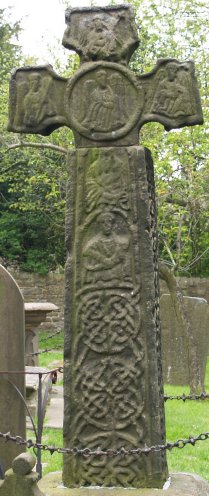 The 8th century Saxon Cross in churchyard of Eyam Parish Church