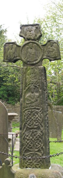 The 8th-9th century Saxon Cross in the 'plague' village of Eyam's St Lawrence Church graveyard, Derbyshire