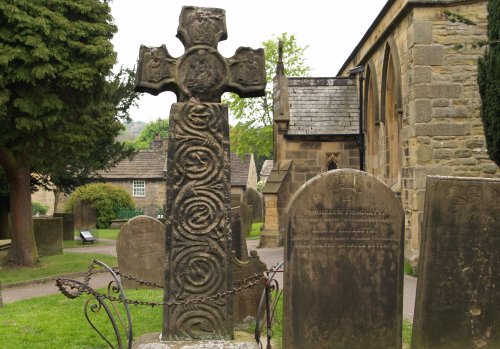 The 8th century Saxon Cross in churchyard of Eyam Parish Church
