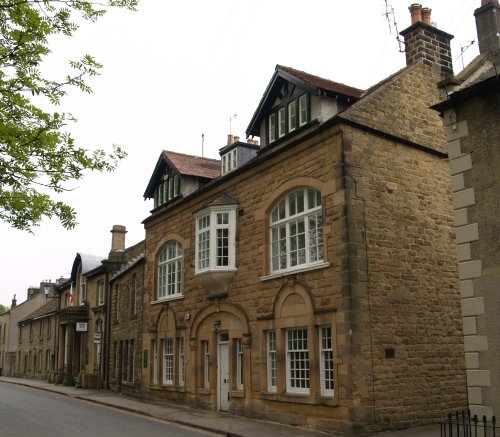 There are many fine buildings in the main street of Eyam.